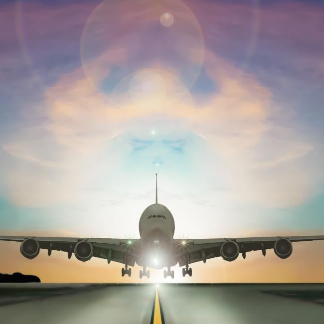 An airplane moving towards the camera on a runway.